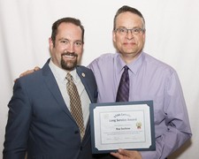 Vice Chair John Tomkinson honours 20 Year Long Service honouree Ray Suchow 