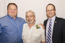 Superintendent Dr. Troy Davies (right) and Principal Jim McMullen (left) honour Gerald Joly (Académie Saint-André Academy) on his retirement.  