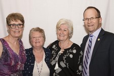 Colleagues Theresa Doherty (far left), Gabriel Byrne (right) and Superintendent Dr. Troy Davies (far right) honour retiree Liz Dorman (Notre Dame School).