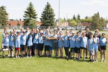 STAR Catholic Vice Chair John Tomkinson presents the TRACK STAR CHALLENGE Cup to Notre Dame School, winners of the event for 2017.